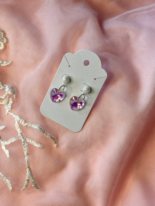 Seraphina Grace Earrings displayed on a card with a soft pink fabric background.